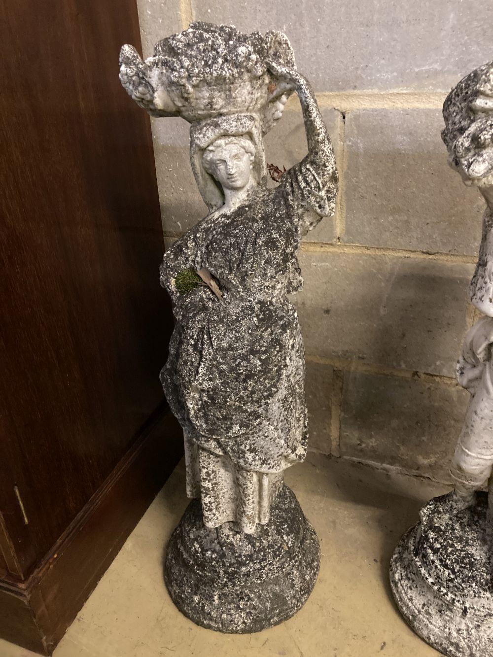 Three reconstituted stone garden ornaments, largest 83cm high